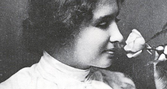 Helen Keller smelling a rose