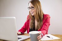 Image of a woman at a computer