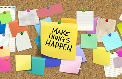 Bulletin board with the largest note reading "Make Things Happen"