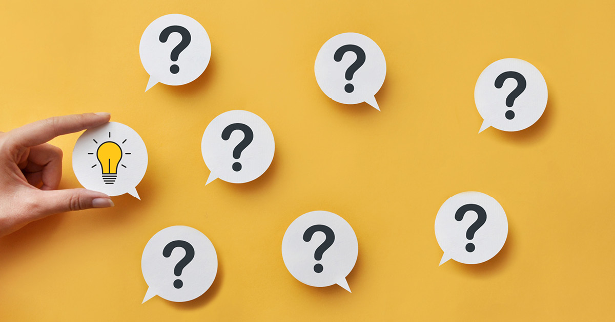 A graphic with 7 question marks in speech bubbles, and a hand holding another speech bubble with an illustration of a shining lightbulb in it.