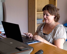 Lisa Seeley Working from Home on her Laptop