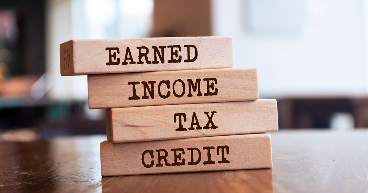 A stack of wooden blocks that say from top to bottom, “Earned. Income. Tax. Credit.” 